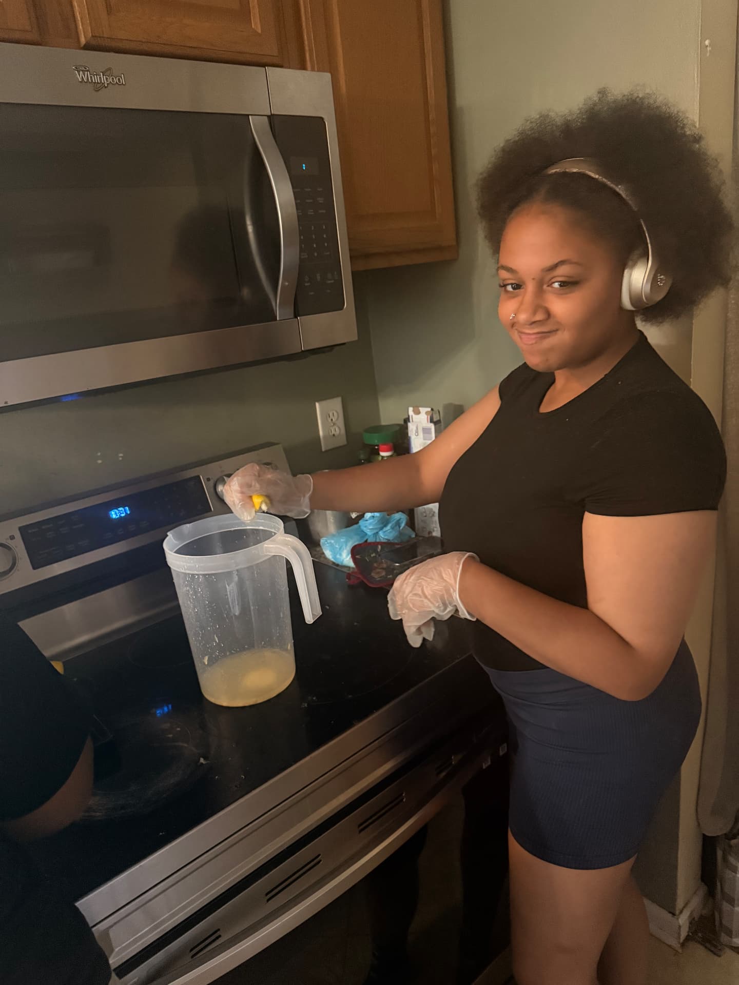 Pouring lemonade into a pitcher